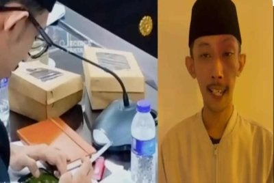 Achmad Syahri dipercayai sedang main permainan video ketika menghadiri mesyuarat tular di media sosial.-Agensi