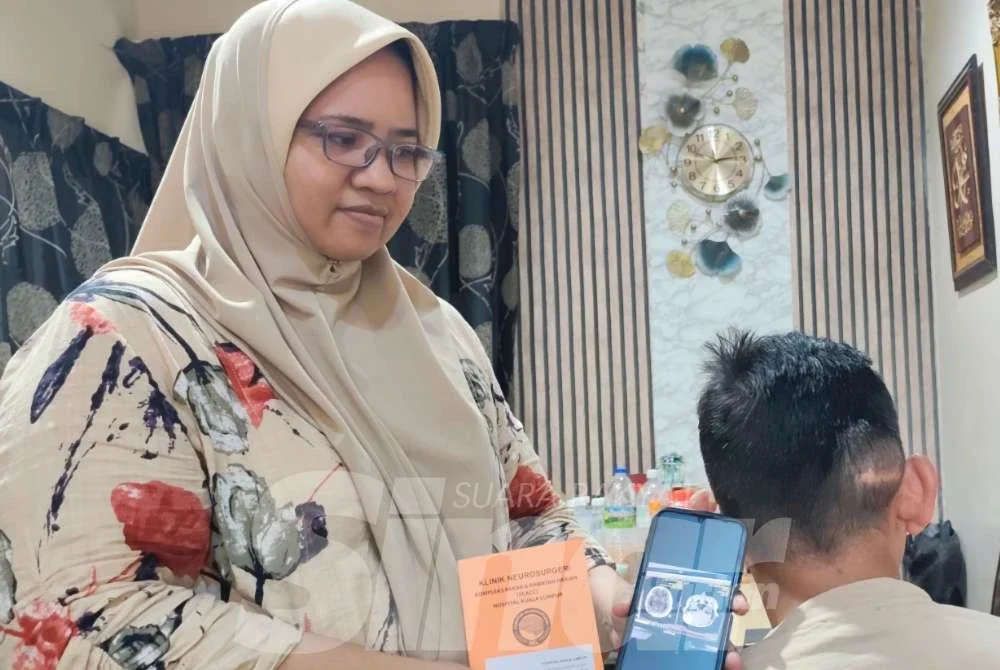 Lailatul menunjukkan keadaan kesihatan suami yang memerlukan pembedahan ketumbuhan di kepala pada Jun depan.
