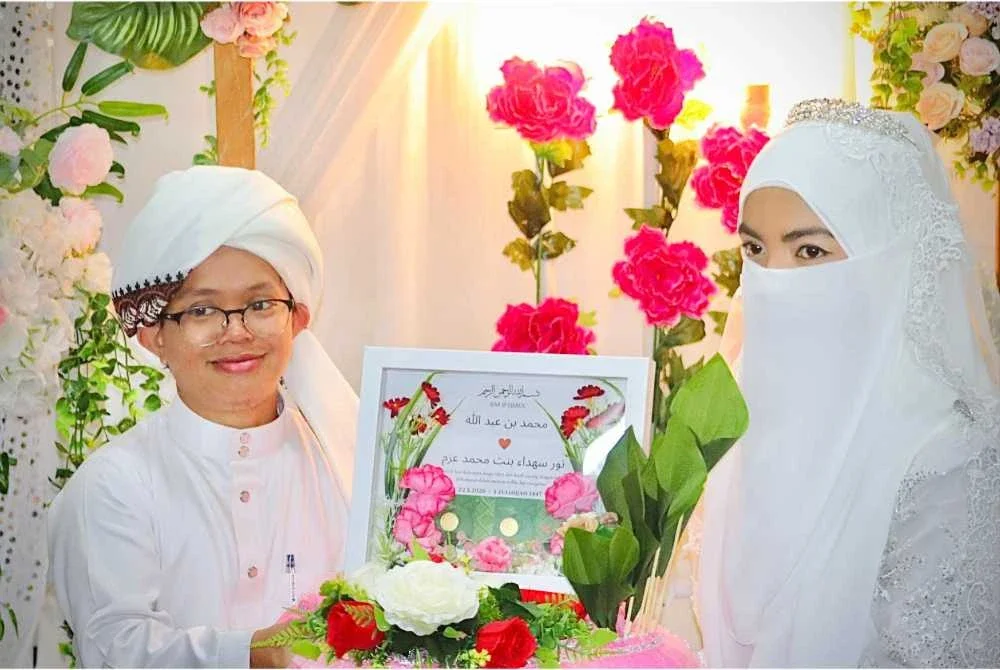 Ustaz Muhammad Abdullah, 33, atau lebih dikenali sebagai Ustaz Mad Kecik selamat melangsungkan perkahwinan bersama pasangannya, Nor Suhada Mohd Azam, 26, pada Jumaat. Foto: Facebook Ustaz Muhammad Bin Abdullah - UMA