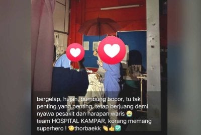 Gambar yang tular memaparkan petugas kesihatan Hospital Kampar terpaksa menggunakan payung selepas air hujan memasuki kawasan wad pesakit.