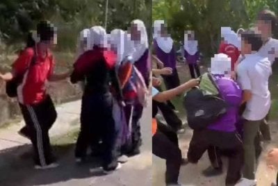 Tangkap layar video tular memaparkan seorang pelajar dipukul oleh sekumpulan pelajar lain di Kota Kinabalu.