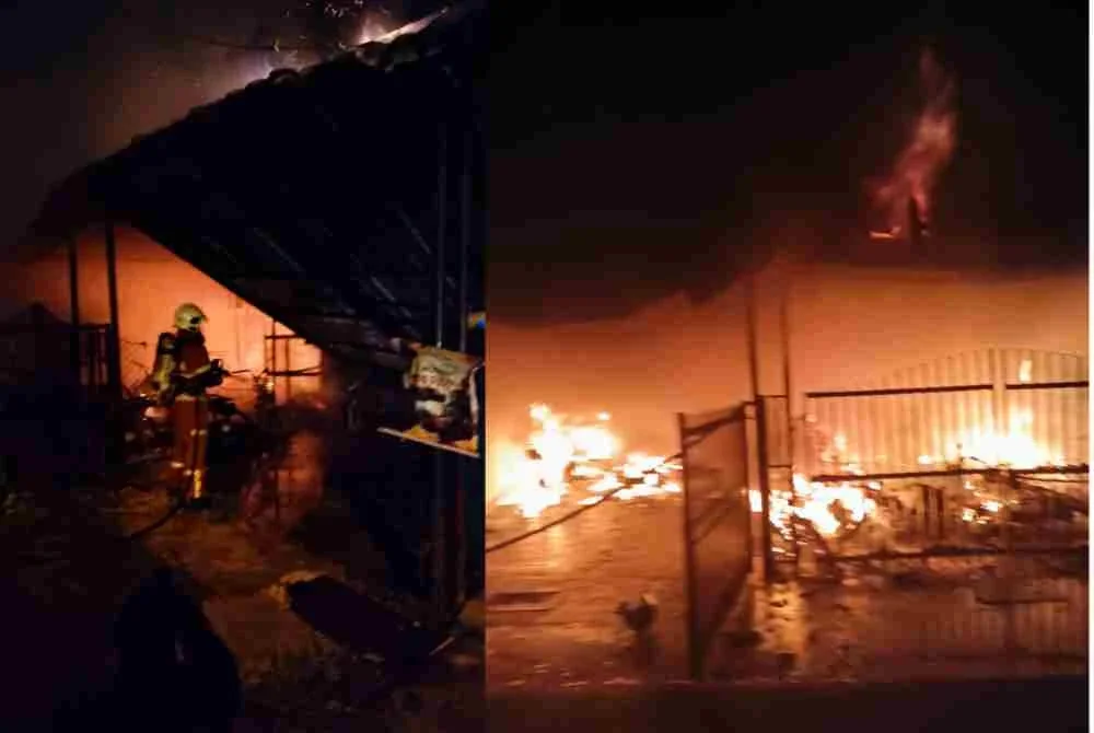 Anggota bomba menjalankan operasi pemadaman kebakaran yang melibatkan lima rumah teres di Taman Londang, Parit Raja, malam Jumaat. - Foto JBPM Johor