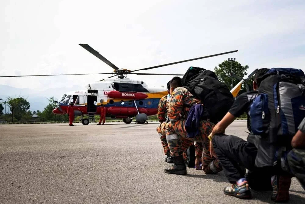 Operasi mencari dan menyelamat (SAR) pendaki wanita, Jaslinda Saludin, 49, yang dilaporkan hilang di Gunung Batu Putih dekat Tapah sejak 23 Mei lepas diteruskan dengan pencarian melalui udara. Foto Bernama