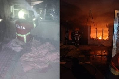 Dua penghuni sebuah rumah teres dua tingkat ditemui dalam keadaan tidak sedarkan diri selepas kediaman mereka terbakar di Jalan Ehsan Jaya 3/10, Taman Ehsan Jaya di sini malam Isnin. - Foto JBPM Johor