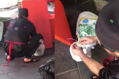 Tangkap layar video tular memaparkan pekerja restoran berkenaan bertindak memasukkan seekor kucing ke dalam guni.