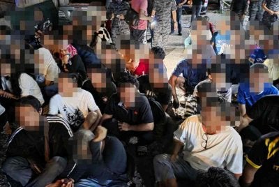 Antara warga asing yang diperiksa dalam Op Sapu di kawasan penempatan di Jalan Klang Lama pada Sabtu.