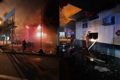 Anggota Balai Bomba dan Penyelamat Yong Peng dan Ayer Hitam melakukan kerja-kerja memadamkan kebakaran. - Foto JBPM Johor