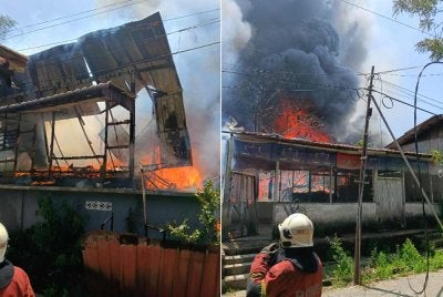 Kebakaran melibatkan 10 buah rumah jenis separuh kekal di Kampung Cina, Kota Bharu pada tengah hari Isnin. Foto JBPM