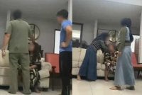 Tangkap layar video tular memaparkan seorang wanita dipercayai pembantu rumah dikasari oleh beberapa individu.