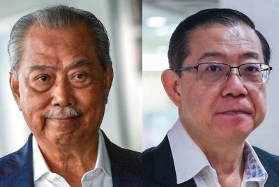 Mahkamah Rayuan pada Khamis mengurangkan jumlah ganti rugi am Penasihat DAP, Lim Guan Eng (kanan) kepada RM450,000 dalam saman fitnah difailkan terhadap Tan Sri Muhyiddin Yassin.