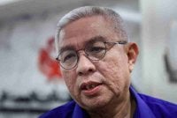 Adham yang merupakan calon bagi kerusi DUN Pasir Raja bercakap kepada pemberita selepas Majlis Pengumuman Calon Barisan Nasional bagi Pilihan Raya Negeri (PRN) Johor ke-16 di Badan Perhubungan UMNO Negeri Johor, pada Rabu. Foto Bernama 