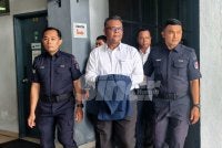 Haim Hilman dibawa polis ke mahkamah.