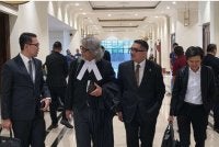 Azhier (kiri) bersama peguam yang terlibat dalam prosiding inkues kematian Zara Qairina di Mahkamah Koroner Kota Kinabalu.