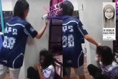Video tular yang tersebar, seorang murid perempuan dilihat menarik rambut dan menampar kepala rakannya, disaksikan oleh murid-murid lain.