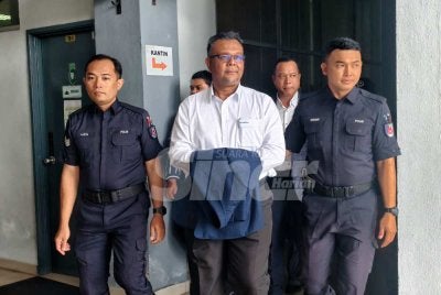Haim Hilman dibawa polis ke mahkamah.