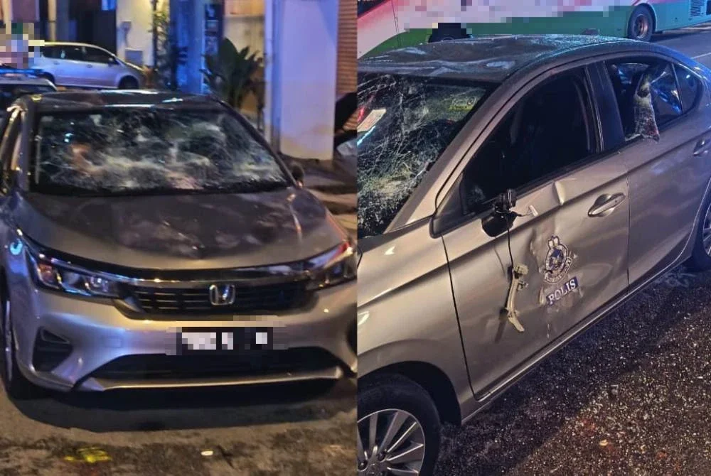 Gambar tular memaparkan sebuah kereta polis rosak akibat dibaling bata oleh suspek pada Rabu.