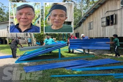 Penduduk bergotong royong membina rakit kecemasan. Gambar atas Dr Sao Chin dan Ibrahim FOTO: ADILA SHARINNI WAHID