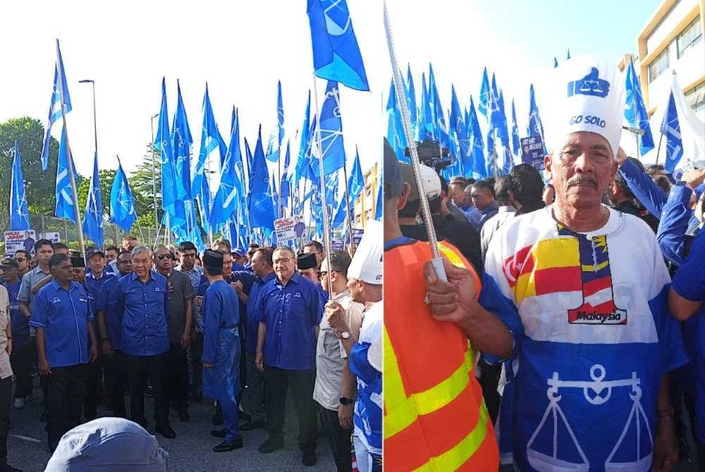 Alias (kanan) turut hadir memberi sokongan kepada Onn Hafiz di perkarangan Dewan Muafakat Majlis Daerah Simpang Renggam, Kluang.