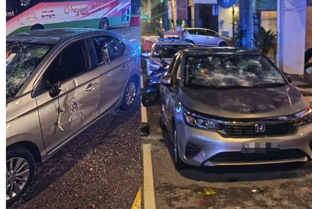 Seorang gelandangan warga asing ditahan selepas merosakkan kereta polis di Jalan Hang Lekiu, Kuala Lumpur Rabu lalu. Foto: Tular