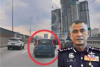 Tangkap layar rakaman video tular sebuah kereta Perodua Viva memecut laju selepas diarah berhenti oleh polis di ibu negara pada Jumaat. - Gambar kecil (Fadil Marsus)