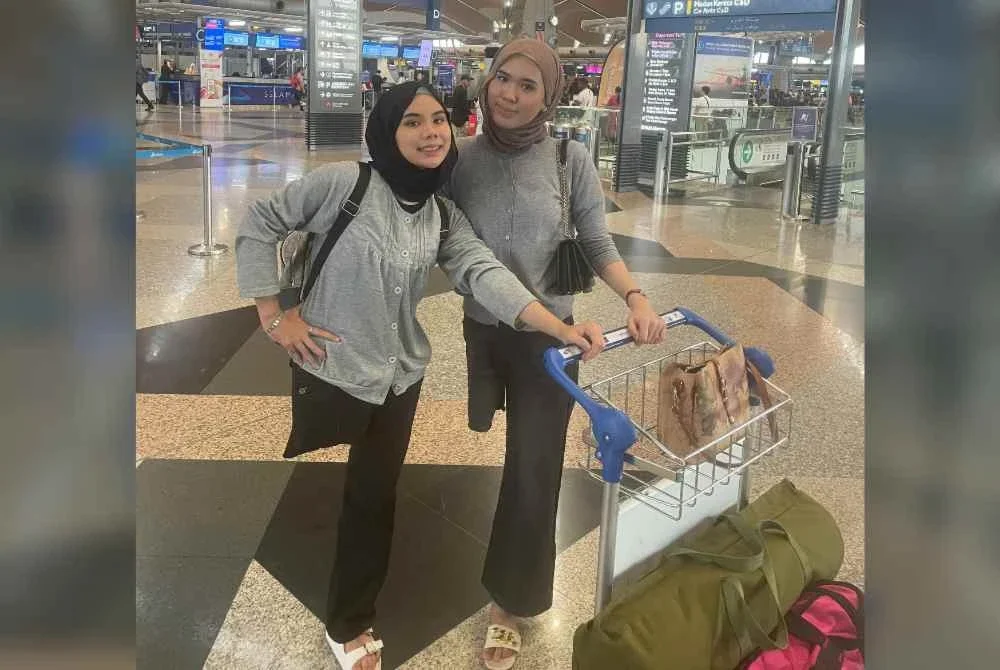 Nik Haziera (kiri) bersama kakaknya, Nik Haznita reda apabila kehilangan satu kaki selepas kemalangan tahun lalu. Foto ihsan Nik Haziera