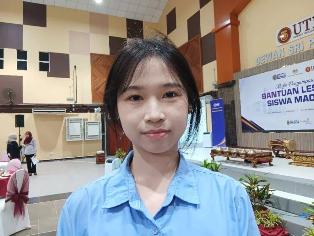 XIN YI