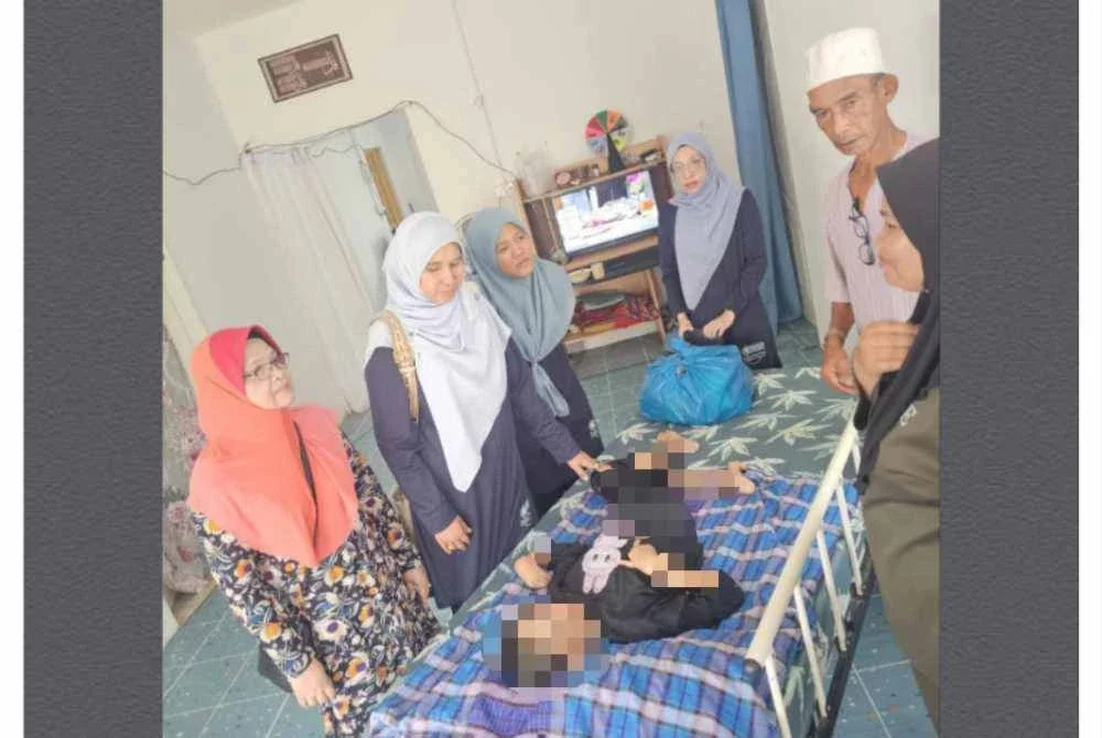 Siti Suraya yang terlantar dan menerima sumbangan makanan. - FOTO: Yayasan Che Mas