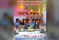 Tangkap layar video yang tular menunjukkan sekumpulan warga asing menonton tarian seorang wanita di sebuah premis di pusat bandaraya Ipoh baru-baru ini.