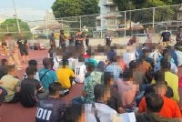 Antara warga asing yang ditahan menerusi Op Kutip di sekitar pasar malam Taman Maluri, Kuala Lumpur pada Ahad.