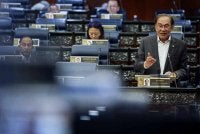 Anwar menjawab soalan pada Waktu Pertanyaan-Pertanyaan Menteri sempena Mesyuarat Kedua, Penggal Kelima, Majlis Parlimen Kelima Belas di Bangunan Parlimen pada Selasa. Foto Bernama