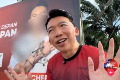 Tangkap layar media sosial Chee Hong yang memaparkan papan iklan kempennya di conteng dengan ayat tidak senonoh. 