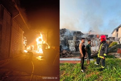 Anggota bomba sedang menjalankan kerja pemadaman pada Ahad.