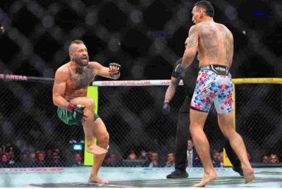 Tindakan McGregor memulakan pertarungan dengan tendangan 'roundhouse' membawa padah apabila lututnya cedera menyebabkan pertarungannya dengan Max Halloway hanya bertahan selama 69 saat. - Foto: Agensi