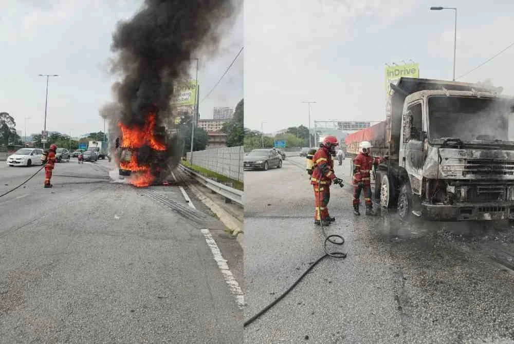 Anggota bomba sedang memadamkan kebakaran sebuah lori di MRR2 di sini pada Rabu.
