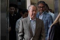 Bekas Perdana Menteri Tan Sri Muhyiddin Yassin hadir bagi perbicaraan kes rasuah dan pengubahan wang haram yang melibatkannya di Mahkamah Tinggi pada Rabu. Foto Bernama. 