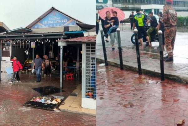 Anggota bomba sedang memantau keadaan banjir di Medan Selera 223, Seksyen 51A susulan hujan lebat pada Sabtu.