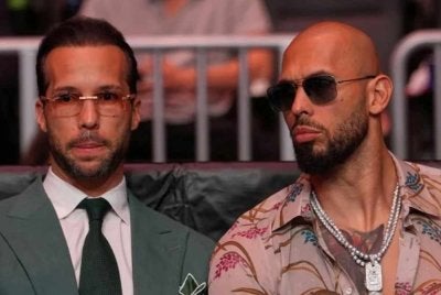 Andrew (kanan) dan Tristan ditahan di Miami. Foto: Reuters