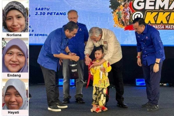 Ahmad Zahid (dua kanan) hadir merasmikan program berkenaan di Felda Palong 8, Jempol pada Sabtu.