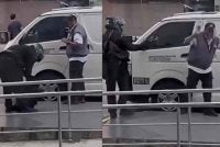 Tangkap layar rakaman video tular memaparkan tindakan suspek berpakaian serba hitam cuba menyamun wang tunai RM82,000 di hadapan sebuah bank di Bandar Bukit Tinggi, Klang pada Isnin.