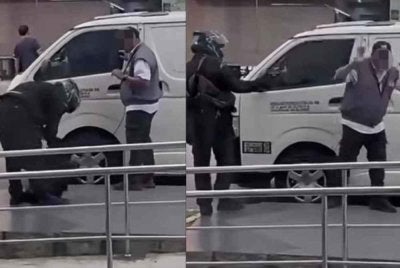 Tangkap layar rakaman video tular memaparkan tindakan suspek berpakaian serba hitam cuba menyamun wang tunai RM82,000 di hadapan sebuah bank di Bandar Bukit Tinggi, Klang pada Isnin.