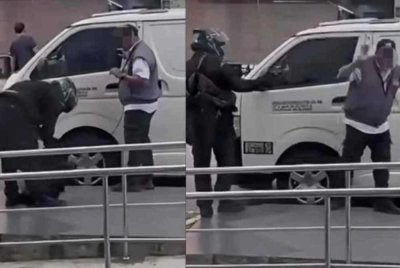 Tangkap layar rakaman video tular memaparkan tindakan suspek berpakaian serba hitam cuba menyamun wang tunai RM82,000 di hadapan sebuah bank di Bandar Bukit Tinggi, Klang pada Isnin.