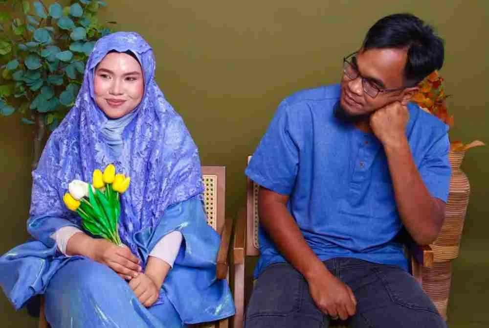 Nor Syaqirah bergambar bersama Allahyarham Mohammad Amirul.