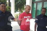 Tertuduh dibawa keluar dari Mahkamah Sesyen selepas pertuduhan dibacakan pada Khamis. 