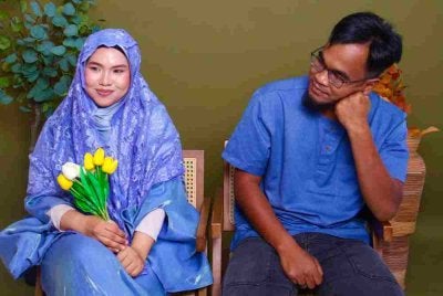 Nor Syaqirah bergambar bersama Allahyarham Mohammad Amirul.