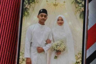 Gambar Allahyarham Adam Harif dan Nadiatull Safera pada majlis perkahwinan mereka di Jalan Nenas, Meru di sini. Adam Haris meninggal dunia selepas enam hari majlis pernikahannya. 