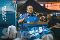 Muhammad Sanusi ketika berucap pada Ceramah Umum Perdana PN dan BN Parlimen Jempol di Bandar Seri Jempol pada Khamis.