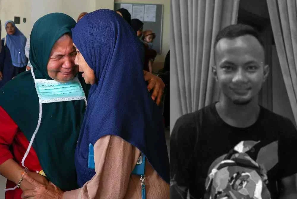 Ibu mangsa iaitu Rozita Ramli, 47, (kiri) tidak dapat menahan sebak sejurus mayat anaknya Mohd Ilham Che Mat Satar, 27, tiba di Hospital Gua Musang selepas ditemukan meninggal dunia di tepi Sungai Galas. Foto Bernama