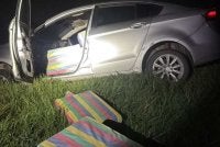 Kenderaan yang dipandu suspek terbabas ke dalam tali air di Kampung Kok Bedullah, Tumpat pada Ahad. Foto PGA