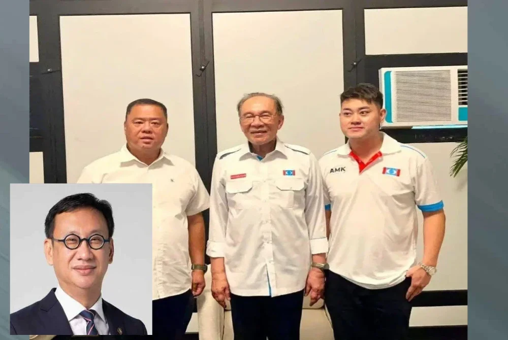 Foto tular memaparkan individu dipercayai Nicky (kanan) bergambar bersama Anwar dengan memakai baju AMK. Gambar kecil: Wong Chen.