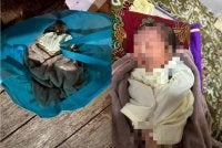 Keadaan bayi perempuan yang ditemui dalam beg kain di pekarangan Masjid Al-Jamhuriah, Kuala Besut pada Selasa.